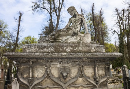 Tombstone with female sculpture and the Cross, Lviv, Ukraineの写真素材