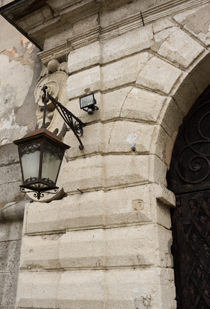 Vintage lamp on the wall. The historic center of the city. Western Ukraineの写真素材