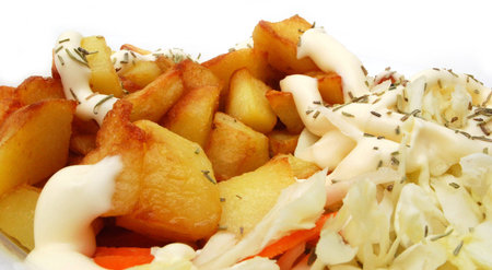Fried potatoes on the plate isolated on white background