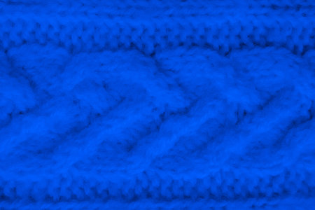 Handmade knit material with detail weave threads.