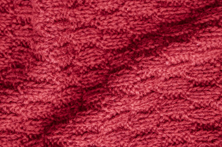 Organic knitting material with macro weave threads.