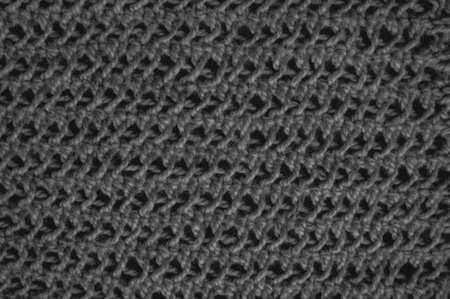 Handmade knitting background with macro woven threads.