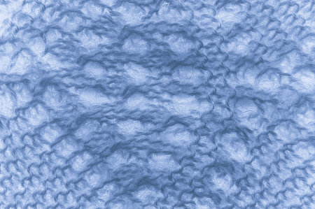 Organic knit material with detail woven threads.