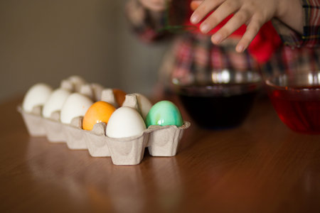 Happy easter. Little girl painter painted eggs. Kid preparing for Easter. Painted hand. Finger...