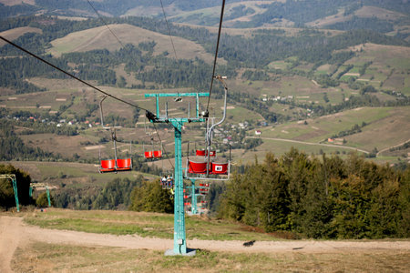 View from the chairlift ride to mountains with beautiful nature background. Ukrainian Carpathians