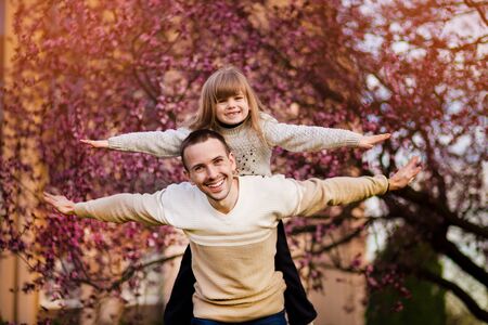Happy father and child spending time outdoors. Lets fly. Family supportの写真素材