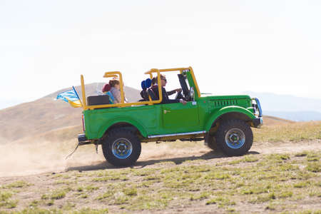 Pylypets, Ukraine - 15 September, 2019: Group of people travel by car on mountains top. Travel conceptのeditorial素材