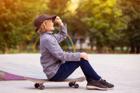 Young sporty girl riding on longboard in park. Lifestyle conceptの写真素材
