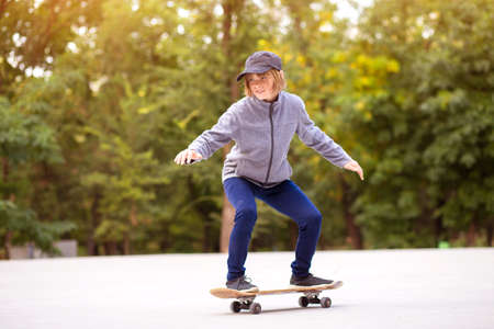 Young sporty girl riding on longboard in park. Lifestyle conceptの写真素材