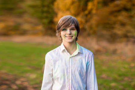 Child playing with color in holi festival. Holi celebrations, girl playing holi in India.の写真素材