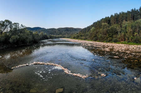 Aerial panoramic view of mountain river stream wild landscape on scenic sunny day in summerの写真素材