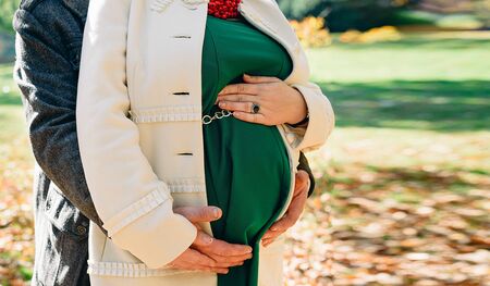 Pregnancy, the hands of a woman on his stomachの写真素材