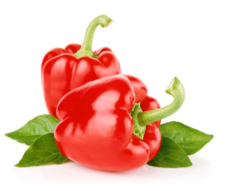 fresh peppers fruit with green leaves isolated on white backgroundの写真素材