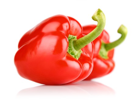 fresh red pepper fruits isolated on white backgroundの写真素材