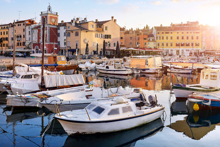 Motorboats and boats on water in port of Rovinj.の写真素材