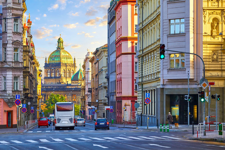 Street in Prague, Czech Republic. Cityscape with road and view at dome of national museum building.の写真素材