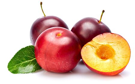 Fresh plum in cut with green leaf. Fruity still life. Healthy food. Isolated on white background.