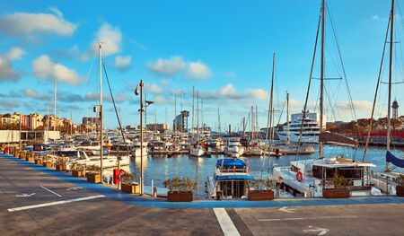 Marine port Vell in Barcelona, Spain. Luxury yaghts in the sea bay. Evening sunset.の写真素材