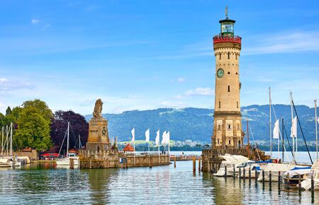 Old lighthouse with clock in bay.の写真素材