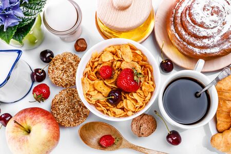 Breakfast fresh croissant coffee berry and honey. Still life of sweets and fruits top view.の写真素材