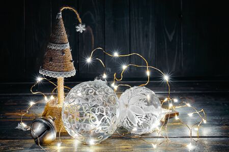 Christmas fir-tree with white glass balls and garland.の写真素材