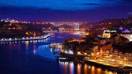 Porto, Portugal. Evening sunset panoramic view at nighttime townの写真素材
