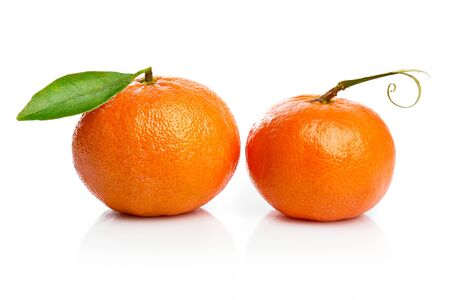 Ripe tangerines with green leaf for design packing. Fruity still life citrus. Isolated on white background.の写真素材