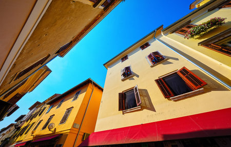 Croatia Porec. Old house with window and wooden shutter. Sunny day with blue sky.
