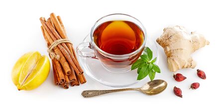 Cup tea with ginger cinnamon mint and lemon. Drink of cold traditional medicine. Isolated on white background.の写真素材