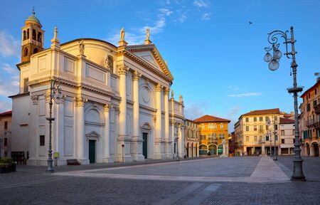 Bassano del grappa Italy, church saint John on freedom square. Deserted morning street with street lamp scenic landscape old town with blue sky.の写真素材
