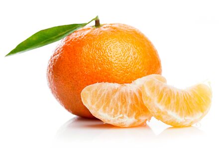 Ripe tangerines with green leaf in cut for design packing.の写真素材