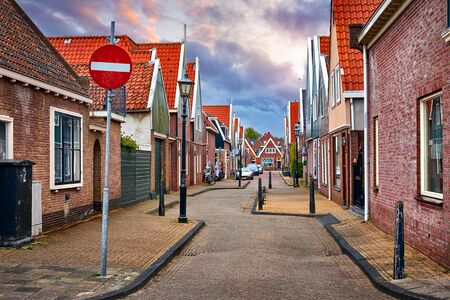Fishing village Volendam panoramic view Holland Netherlands. Small wooden houses blue sky clouds.の写真素材