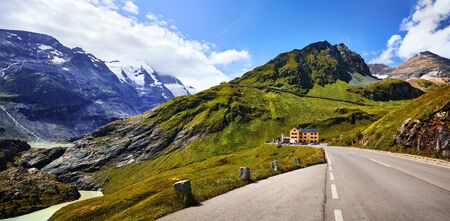 Panoramic view at Pasterze Glacier Grossglockner among austrian Alps mountains summits blue sky clouds.の写真素材
