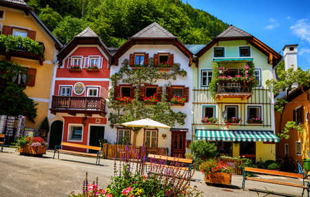 Hallstatt, Austria. Scenic postcard view of historic village town square. Traditional colorful houses at Hallstatter See in Austrian Alps. Salzkammergut region. Flowers in pots and old architectureの写真素材