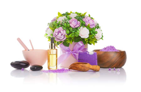 Spa still life. Soap and bath salt with fragrant bunch black stones and oil for massage.の写真素材
