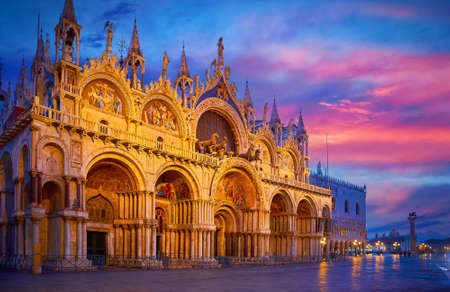 Venice, Italy. Basilica of Saint Mark and Clocktower on Piazza San Marco square. Evening cityscape with street Lamps illumination. Famous Landmark in Venice, basilica di san marco Scenic sunset viewの写真素材