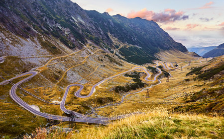 Panoramic mountain road Transfagarasan highway, the most beautiful road in Europe, Romania (Transfagarash) Ridge Fagaras. Scenic view at canyon in Carpathian mountains, Transylvania. Sunset sky cloudsの写真素材