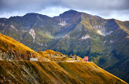 Romania, Carpathian mountains. Panoramic mountain road Transfagarasan, most beautiful highway in Europe, Romanian (Transfagarash) Ridge Fagaras. Scenic view at canyon Transylvania. Sunset sky cloudsの写真素材