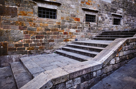 Gothic Quarter in Barcelona Catalonia Spain. Antique stone stairs of medieval buildings. Ancient architecture of old town housesの写真素材