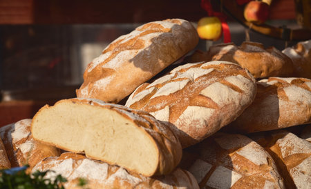 Bread. Fresh crispy crafting hand-made, fresh baked bread. Baking of loaf on old wooden table in...