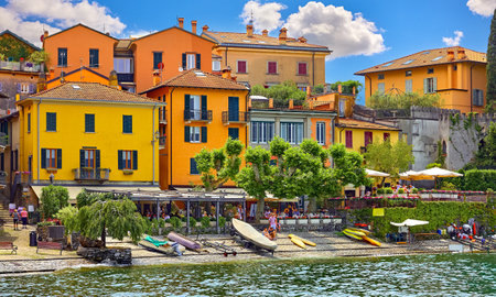 Varenna, Lombardy, Como lake, Italy. Famous Italian village and popular European travel destination for vacation. Summer scenery como town landscape with boats. Sunny summer day.の写真素材