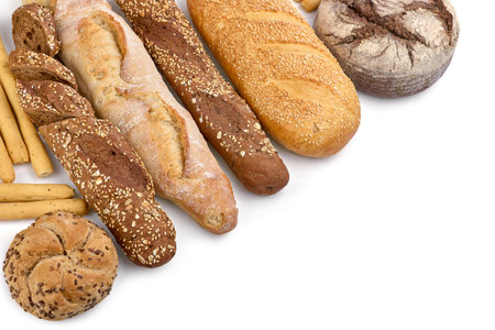 Crafting Bread. Fresh crispy craft hand-made food, fresh baked bread, bagels, buns. Baked goods in a row of loaf. Isolated on white background.の写真素材