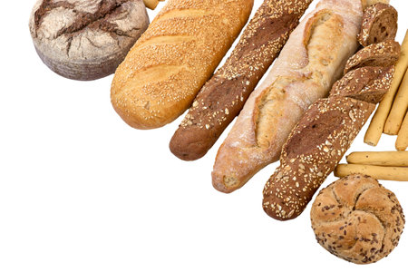 Crafting Bread. Fresh crispy craft hand-made food, fresh baked bread, bagels, buns. Baked goods in a row of loaf. Isolated on white background.の写真素材