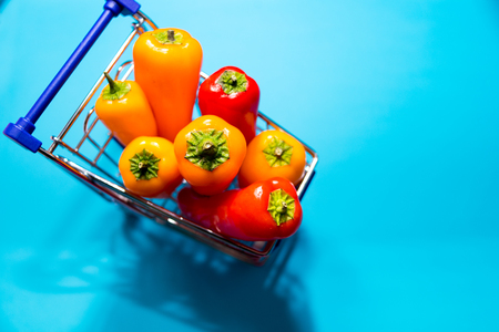 Sweet bell pepper isolated on blue background. Selective focus. Healthy diet eating concept. Lost weight food. Copy spaceの写真素材