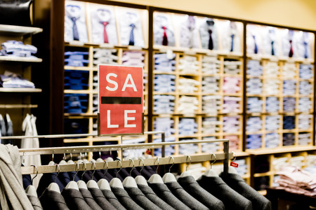 Sale sign in men clothes shop.shopping and discount concept. Retail Image Of A Final Sale Sign In A Clothing Store Selective focus.の写真素材