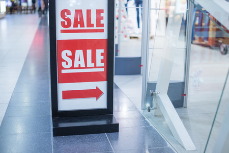 Retail Image Of A Sale Sign In A Clothing Store.shopping and discount concept. Final Sale. 50 percent on store with clothes during winter, spring, summer sale seasonの写真素材