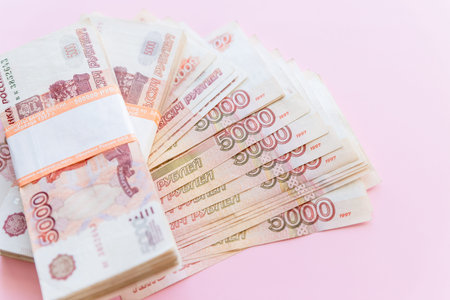Scattered ruble currency banknotes, closeup view. Russian rubles, five thousand bill isolated on...