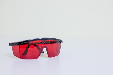 safety glasses isolated on white.protective glasses of dentistsの写真素材