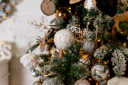 Merry Christmas and happy new year concept, Closeup of white,silver bauble hanging from a decorated...