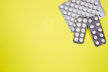 Three blocks of different pills.capsule pills in blister pack.copy space. Health care concept.Pharmaceutical industry concept. Pharmacy drugstore.Heart support. Disease controlの写真素材
